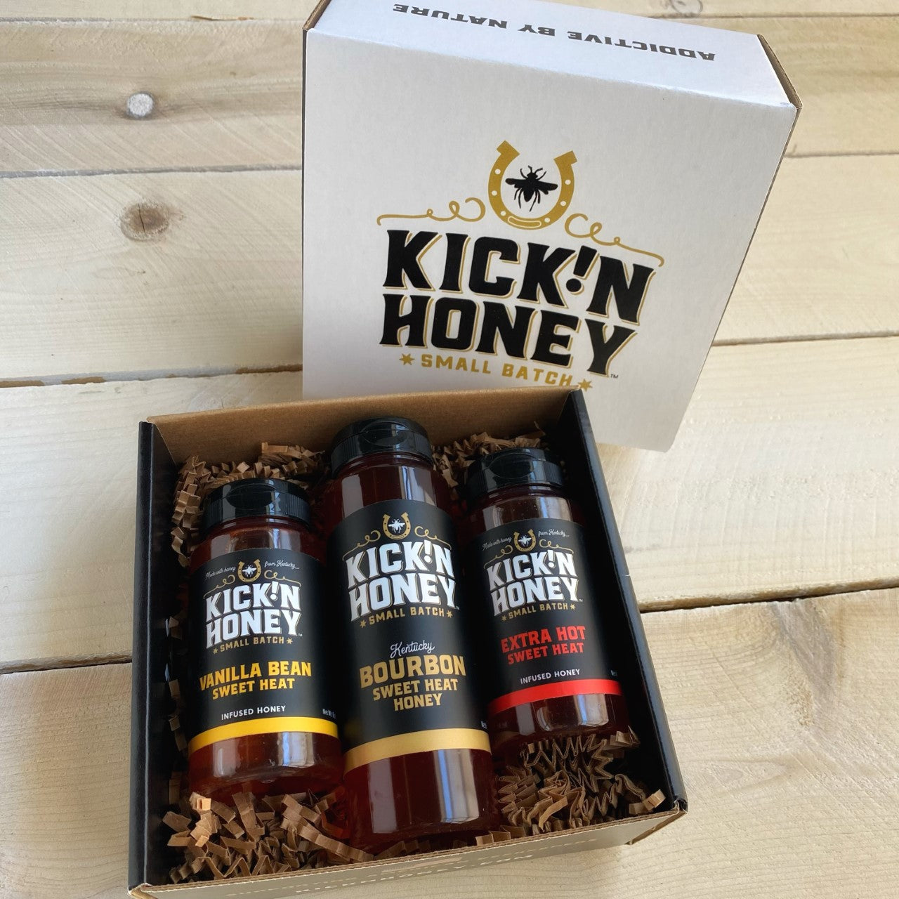 Our Kentucky Bourbon Hot Honey gift box is perfect for the bourbon lover. It features a 12oz. bottle of Kick'n Honey, Bourbon hot honey, plus an bottle of Vanilla Bean Hot Honey and Extra Hot Honey. The gift box is nicely printed so it makes a great gift you can be proud of.